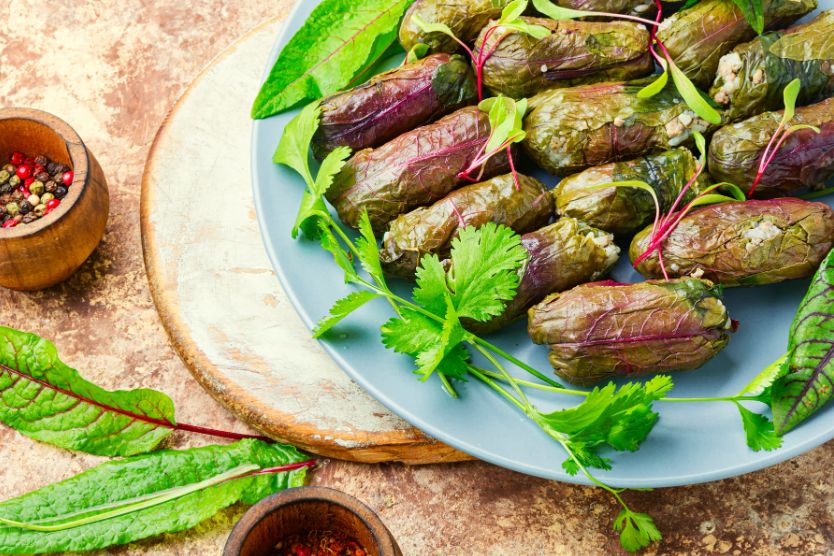 Dolma is ground lamb and rice wrapped with grape leaves and cooked